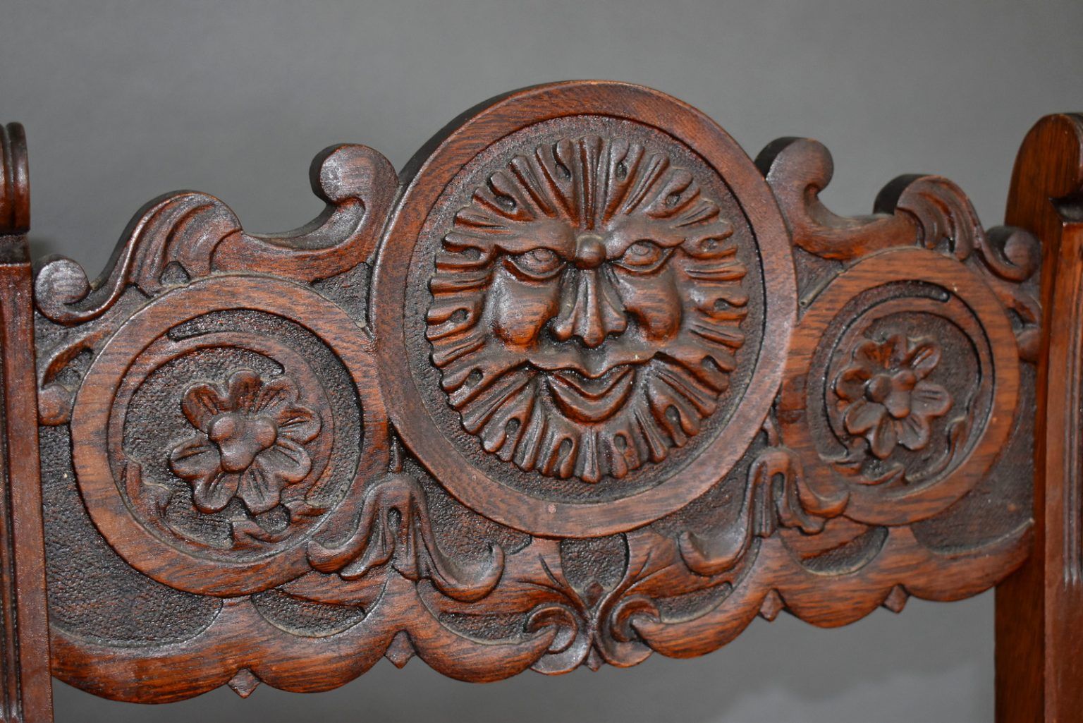 Detail of Barber’s classic “sun” motif carving